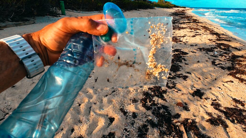 Picture of trash on a beach to help debunk recycling myths