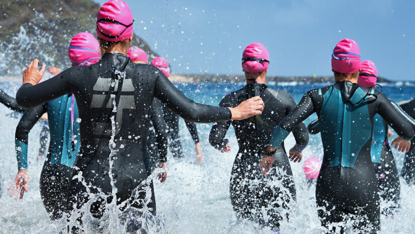 A group of people participating in an aquathlon