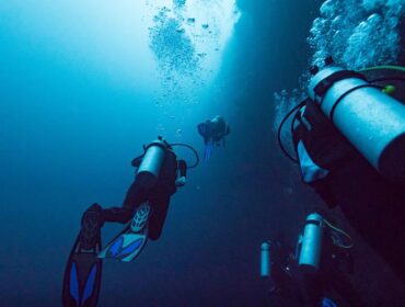 Scuba divers underwater, The Great Blue Hole, Belize Barrier Reef, Lighthouse Reef, Belize