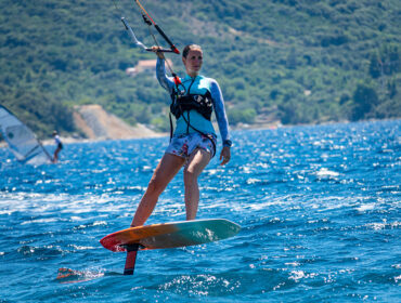 Female athlete shows what is kite foiling