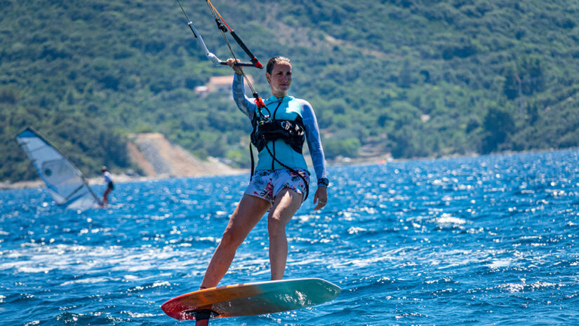 Female athlete shows what is kite foiling
