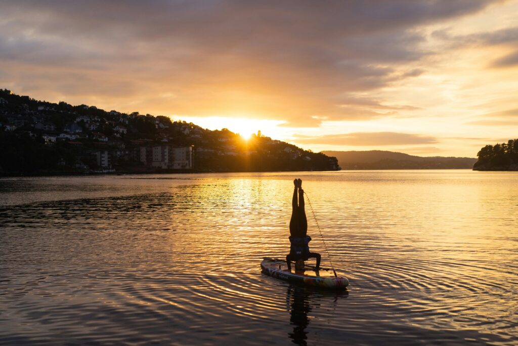 SUP yoga picture at a sunset