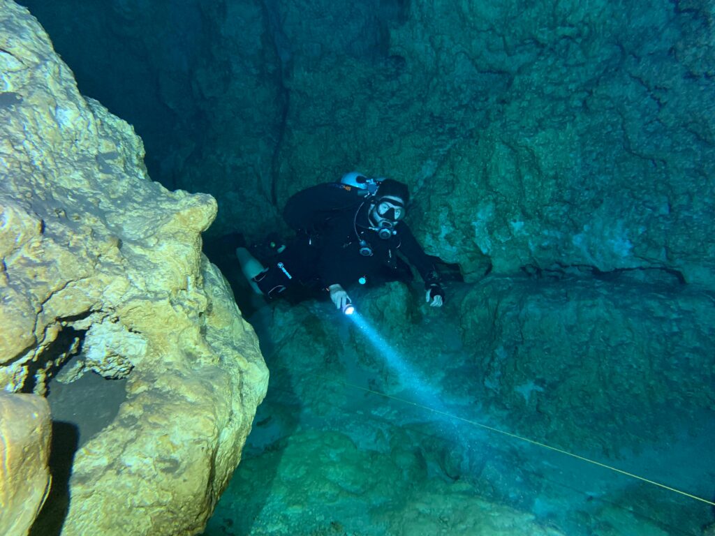 a scuba diver with a dive light