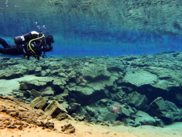 Cold water divers in Silfra