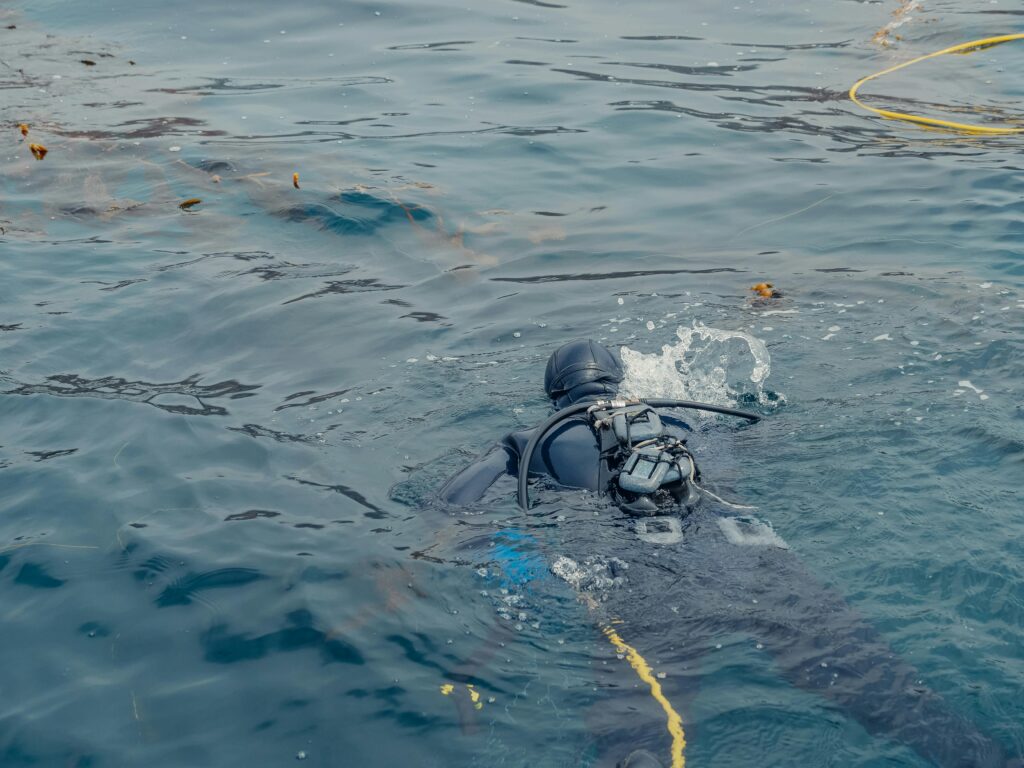 a scuba diver about to descend 