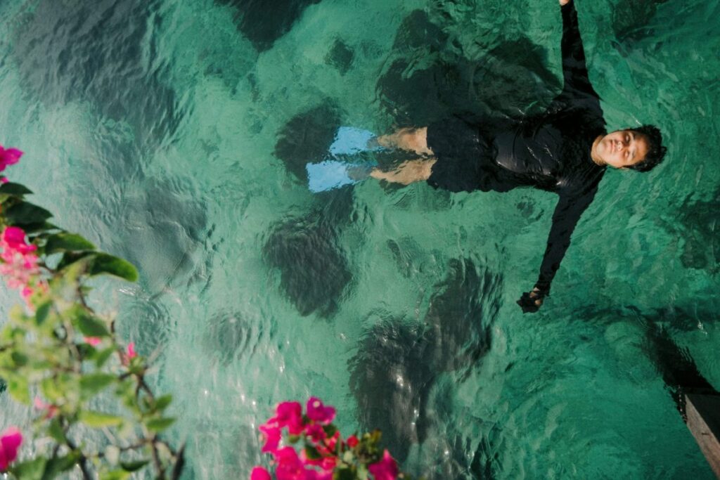 a man swimming in a kid-friendly dive location