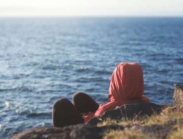a person wondering, "why is the ocean blue?"