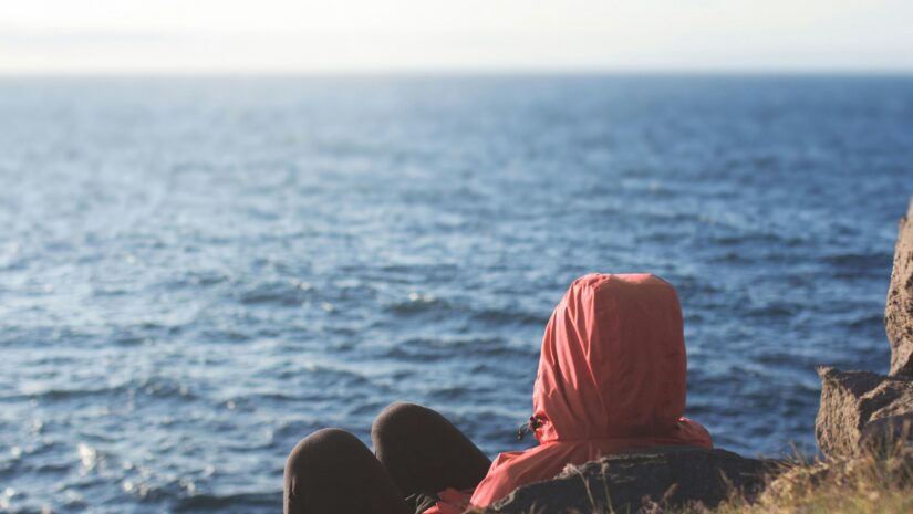 a person wondering, "why is the ocean blue?"