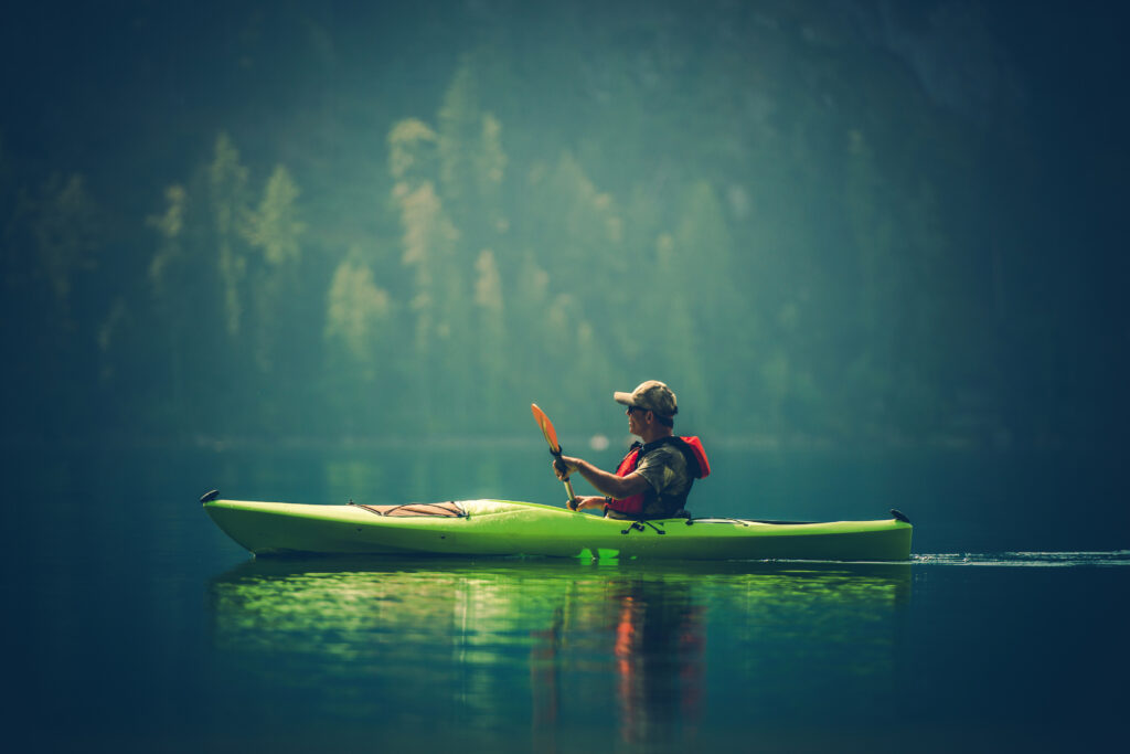 Kayaking on the river via Adobe Stock