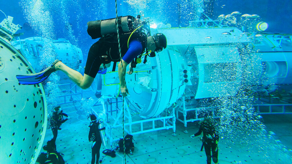 MOSCOW REGION, RUSSIA - FEBRUARY 14, 2014: The International Space Station plunged into the test pool of the Cosmonaut Training Center, divers training.