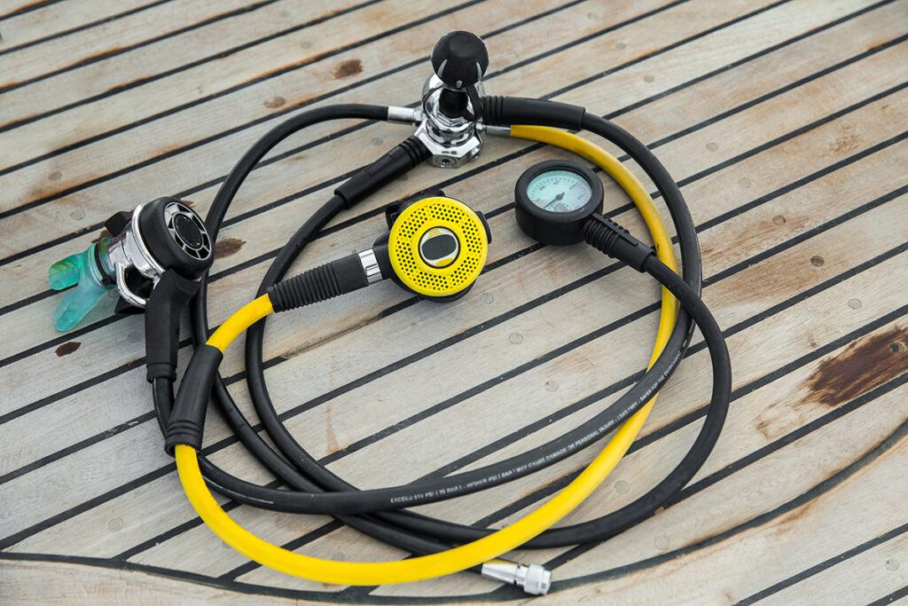 Diving regulators and mouthpiece on boat deck closeup