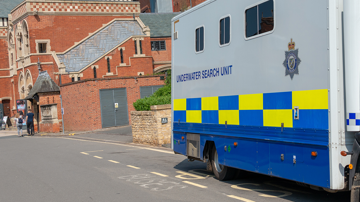 Underwater search unit mobile police scuba diving team parked at roadside whilst searching for a body in a river