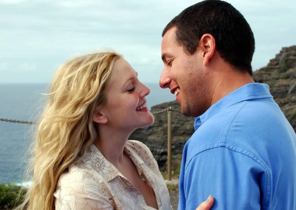 drew barrymore and adam sandler on a beach