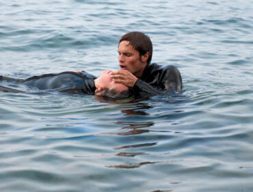 Diver giving CPR to a diving casualty