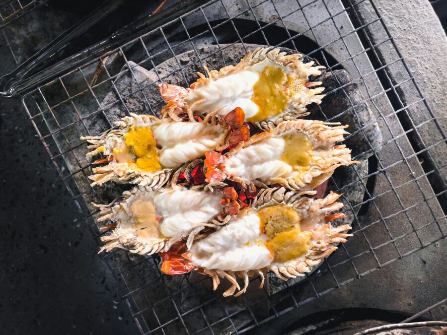 a bunch of food that is on a grill 