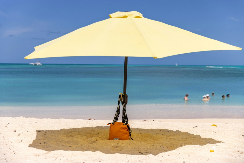 ocean bag under a beach umbrella