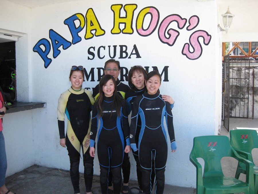 group of divers standing in front of scuba diving school