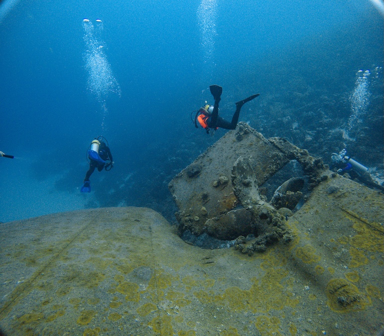 a team of divers wreck diving
