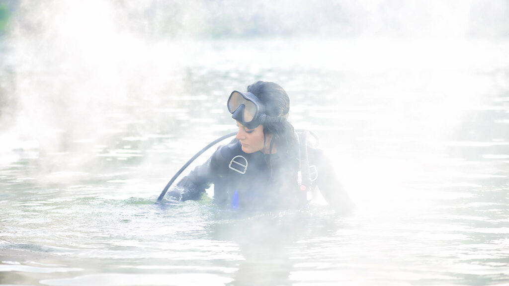 scuba diver in full gear in a foggy area