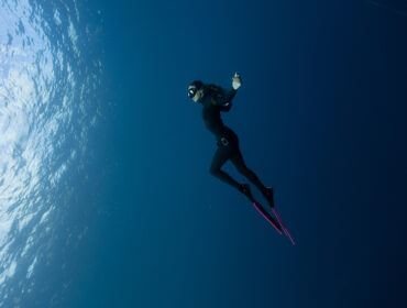 british freediver posing in the ocean